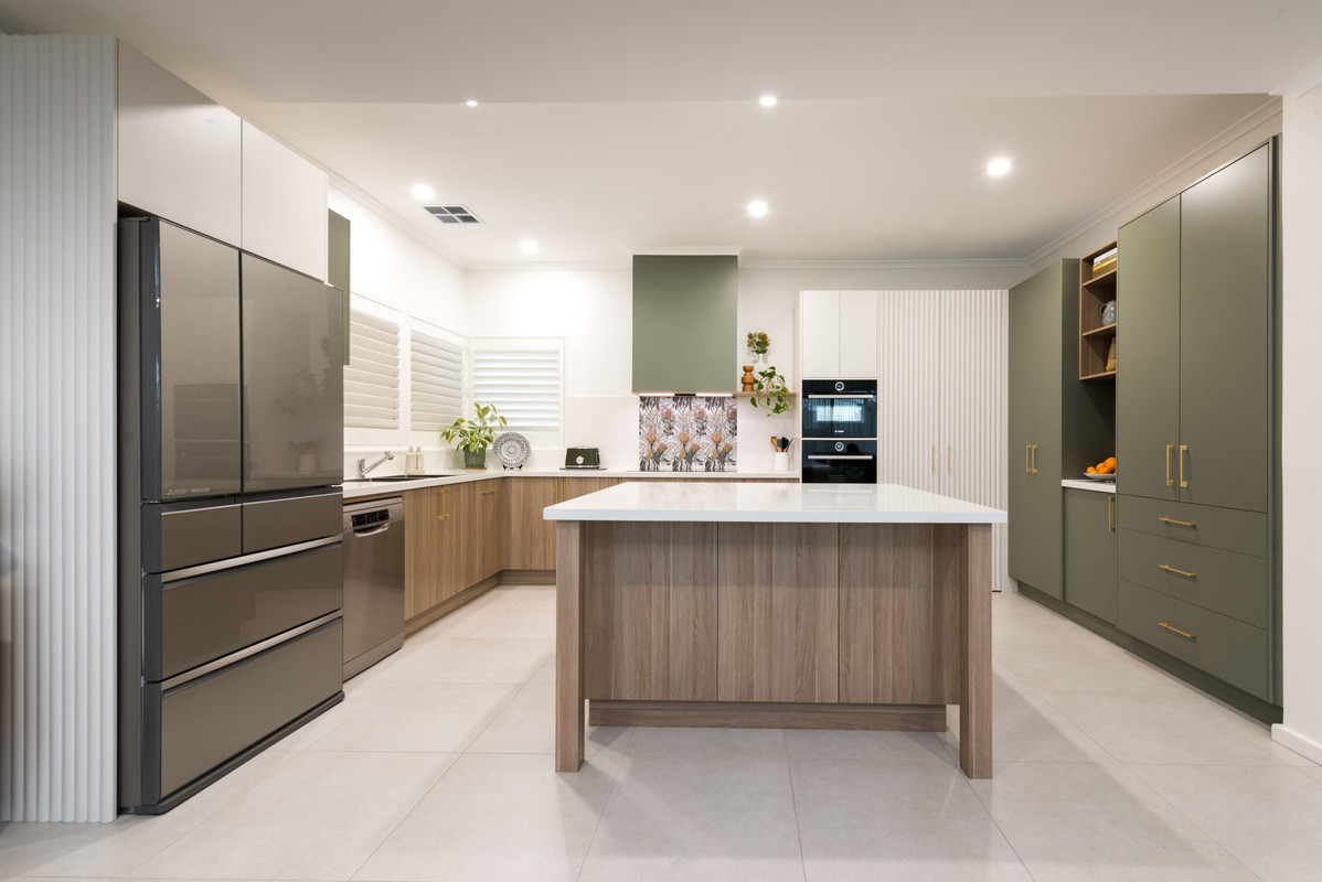 Green timber kitchen cabinets with oak benchtop